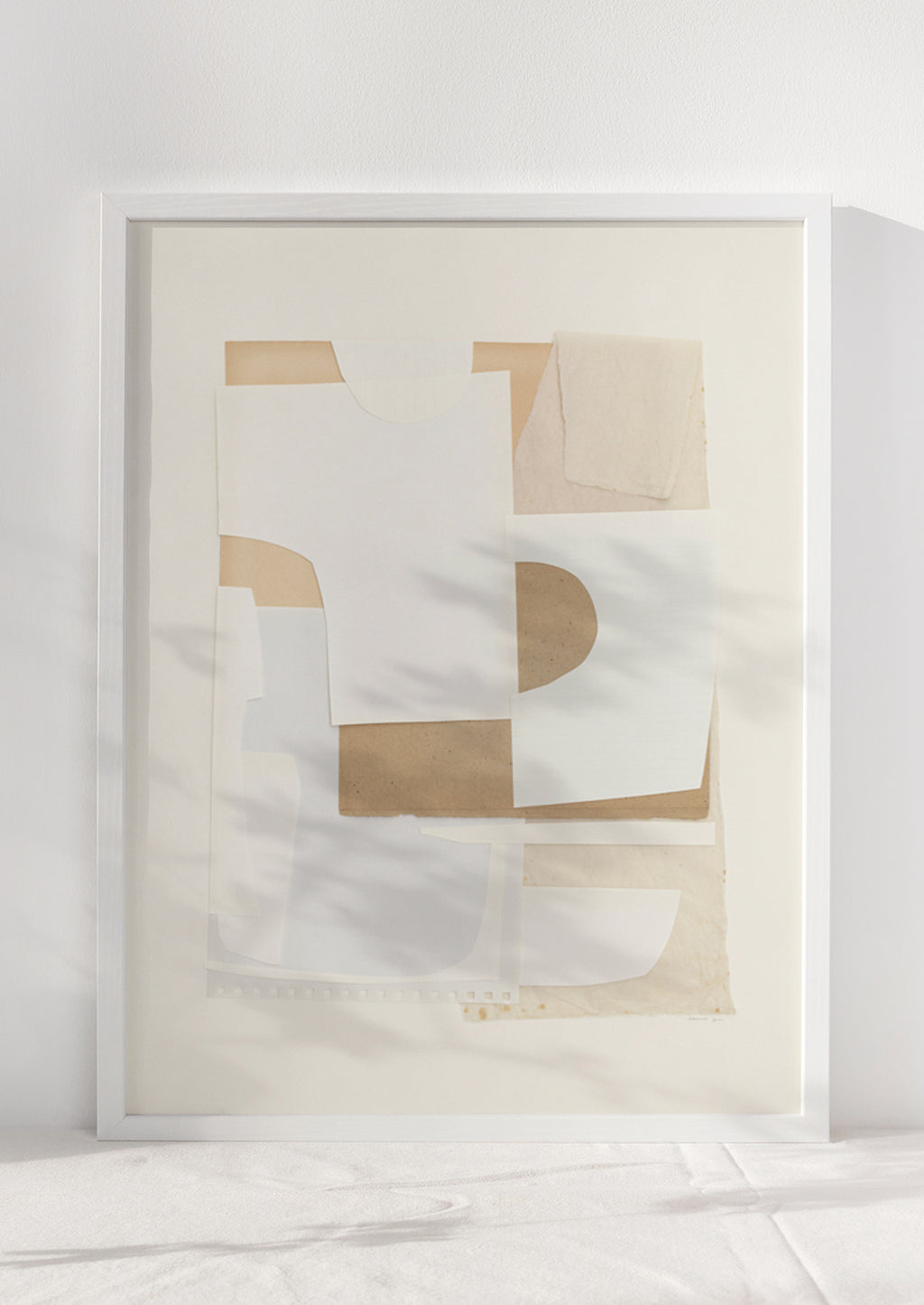 1: An abstract artwork with layers of cutout paper in neutral tones.