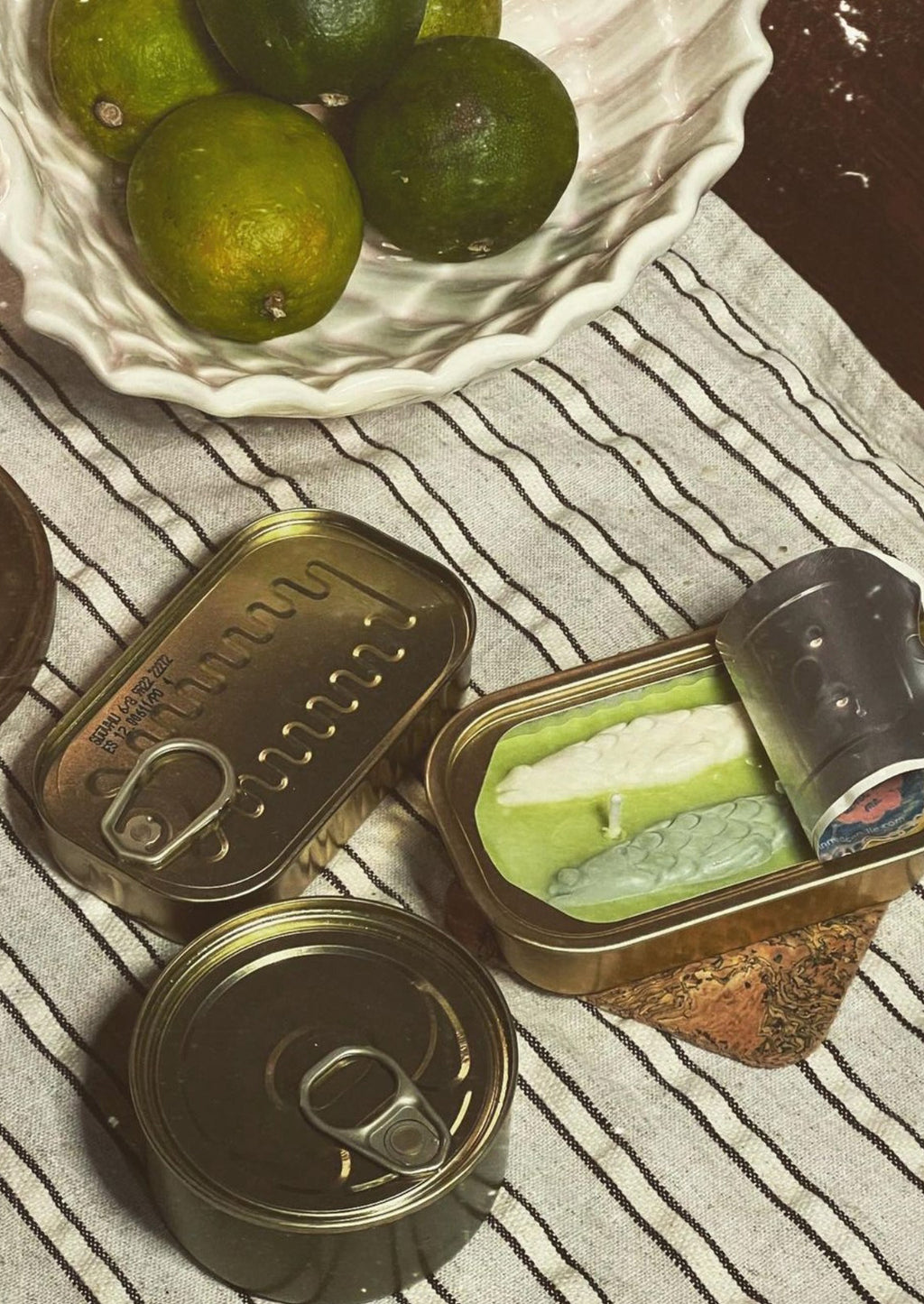 Olive Oil & Sea Salt: Multicolor tin of sardine candles.