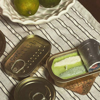Olive Oil & Sea Salt: Multicolor tin of sardine candles.