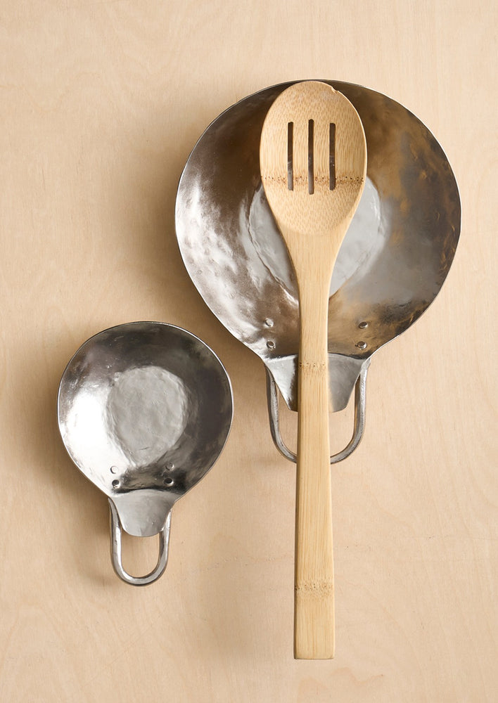 1: Pewter pan-shaped spoon rests with hammered finish.