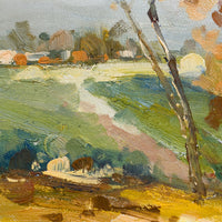 2: A framed oil landscape painting of two trees next to a pond with houses in the distance.
