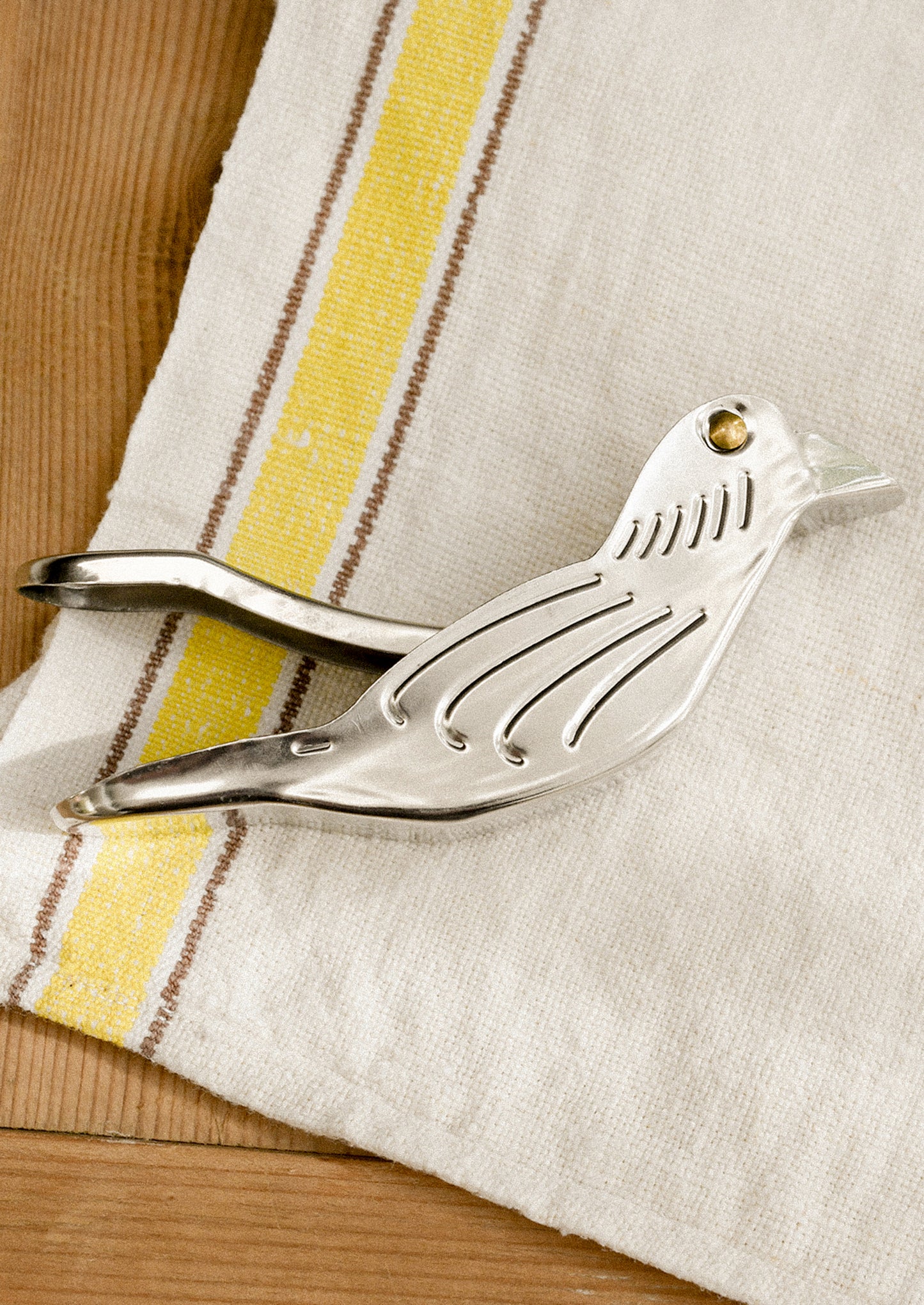 A lemon squeezer device in the shape of a bird.