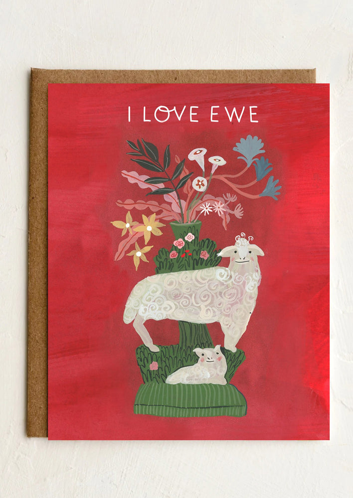 A greeting card with whimsical illustration of sheeps, text reads "I love ewe".