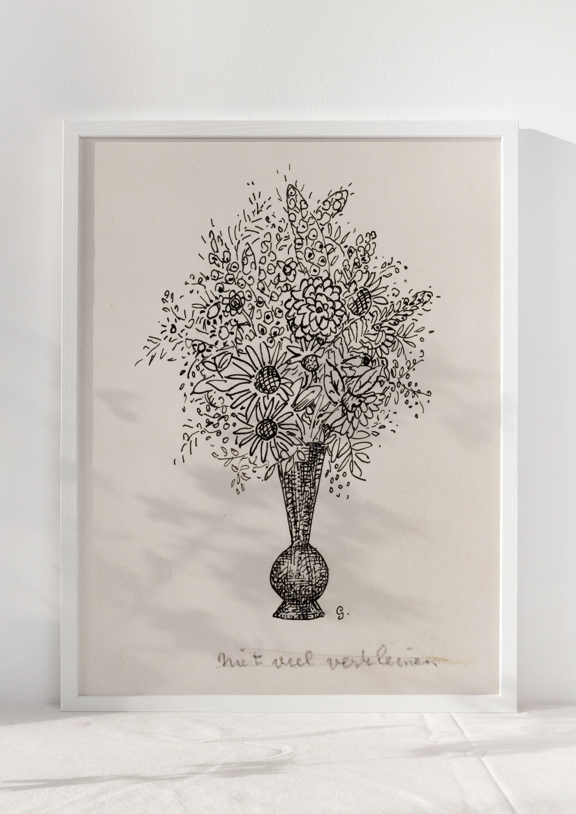 A vintage inspired art print in beige and black of sketch of flowers in vase, in white frame.