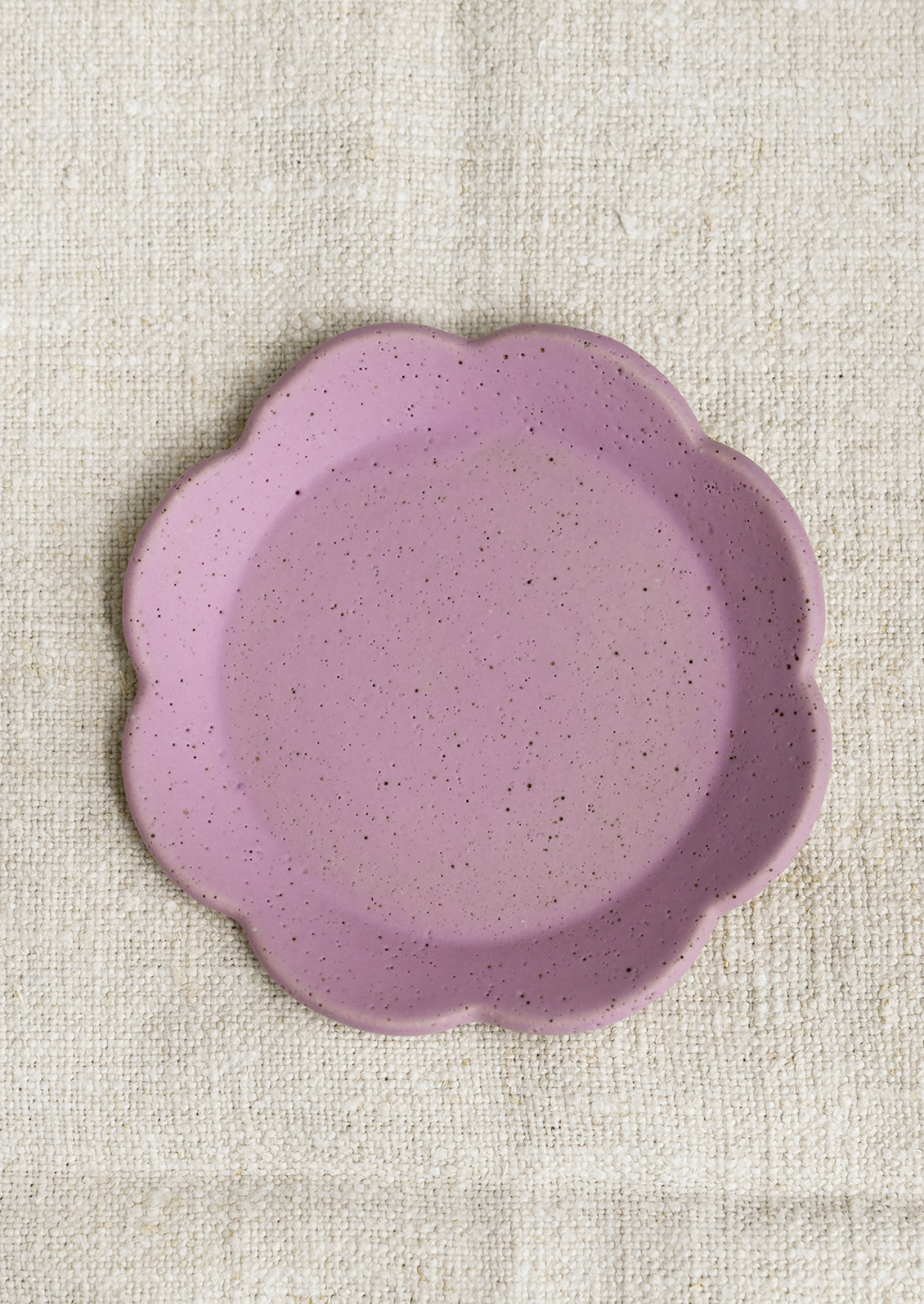 A floral shaped trinket dish in purple.