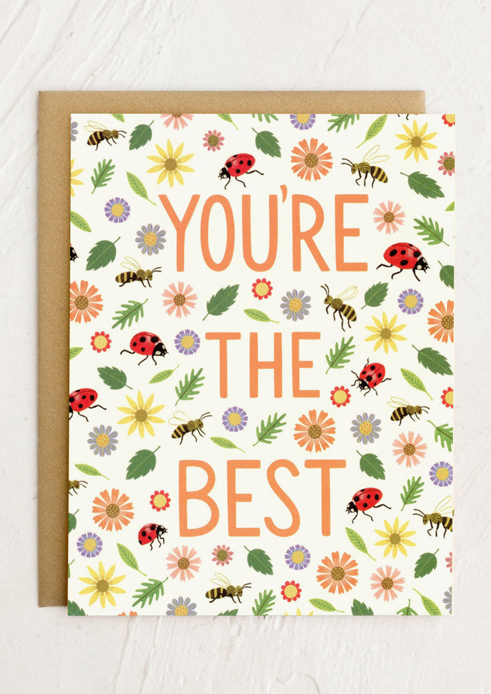 A card with colorful bees and bugs print reading "You're the best".