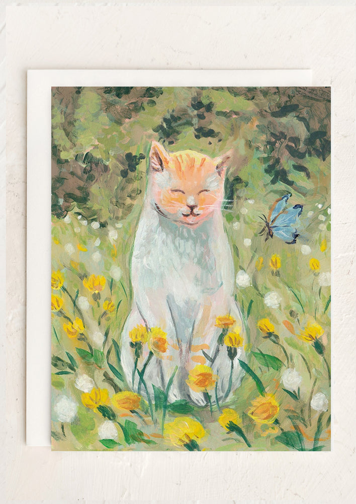 1: A card with illustration of cat smiling in a floral field.