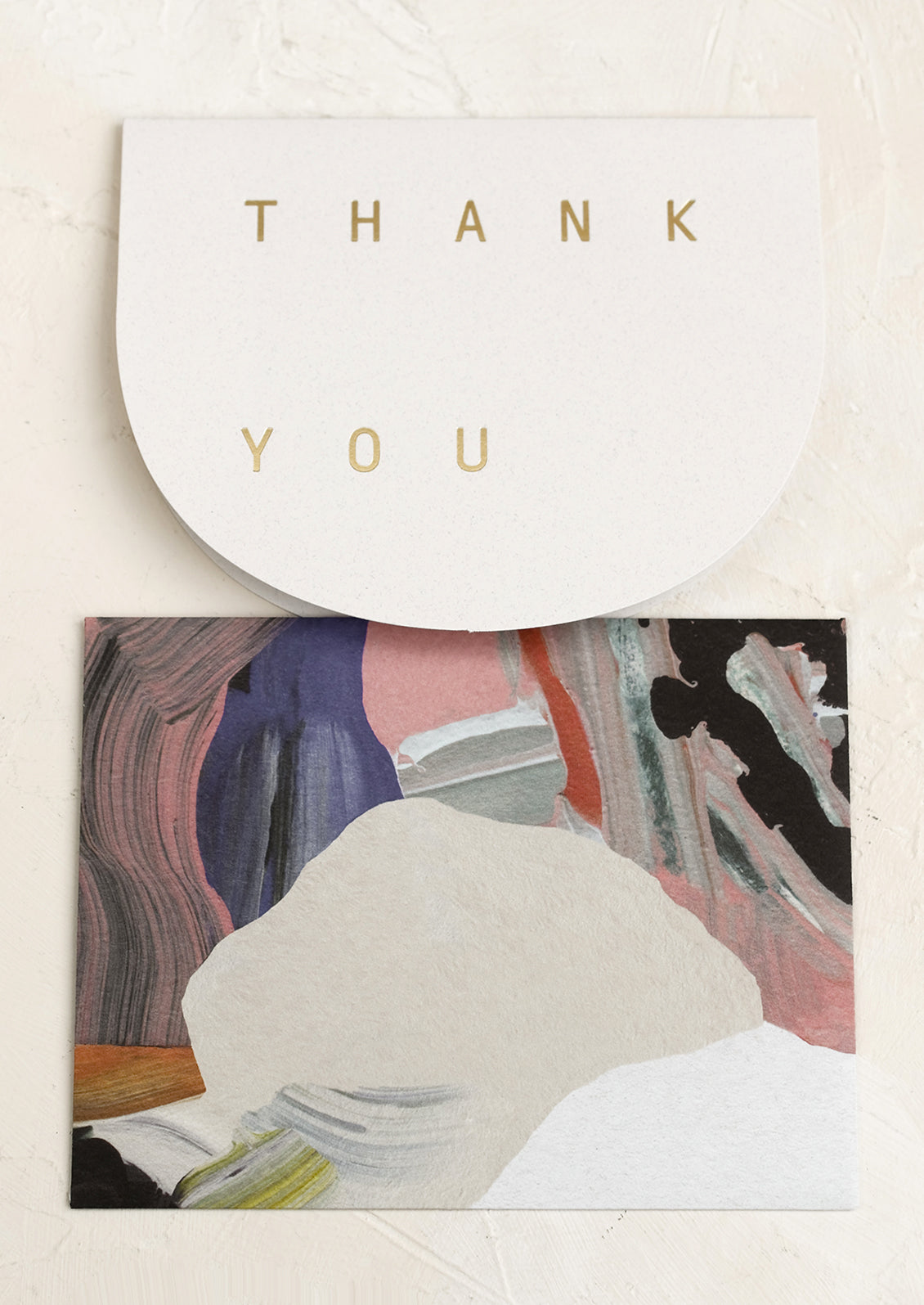 A thank you card with abstract printed envelope.
