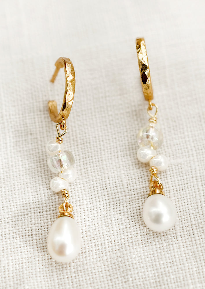 1: A pair of dangling glass and pearl bead earrings with gold-tone hoop post.