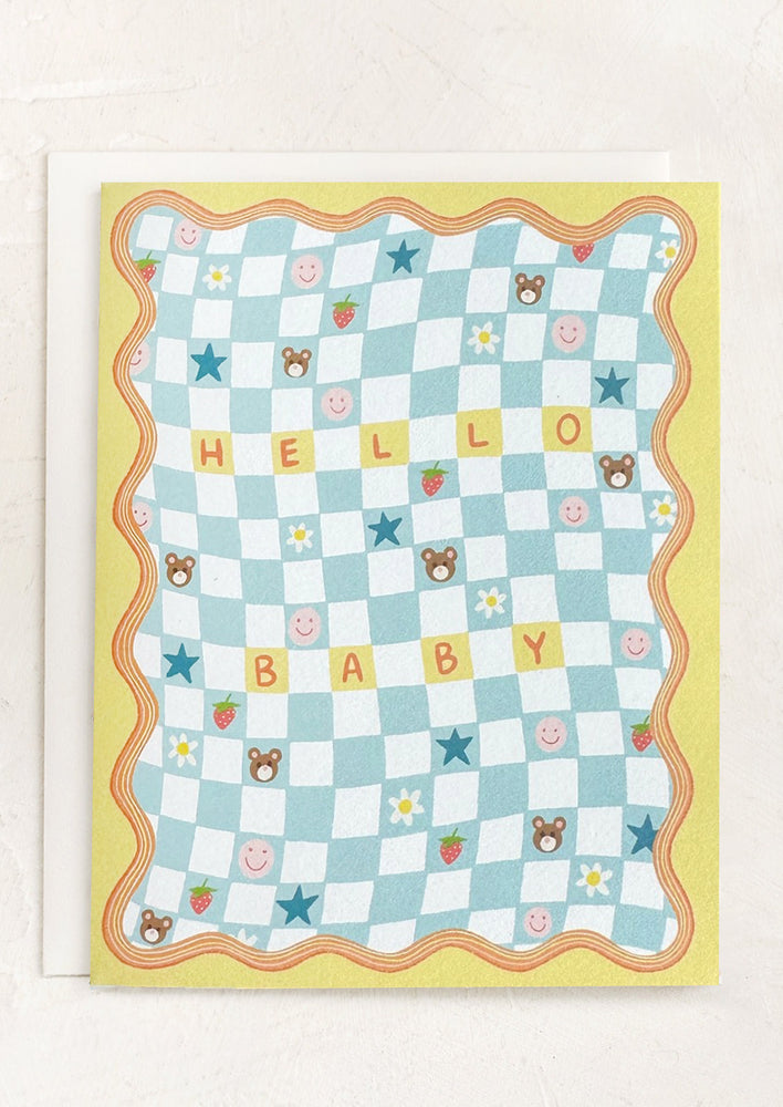 A yellow and blue checker print card reading "Hello Baby".