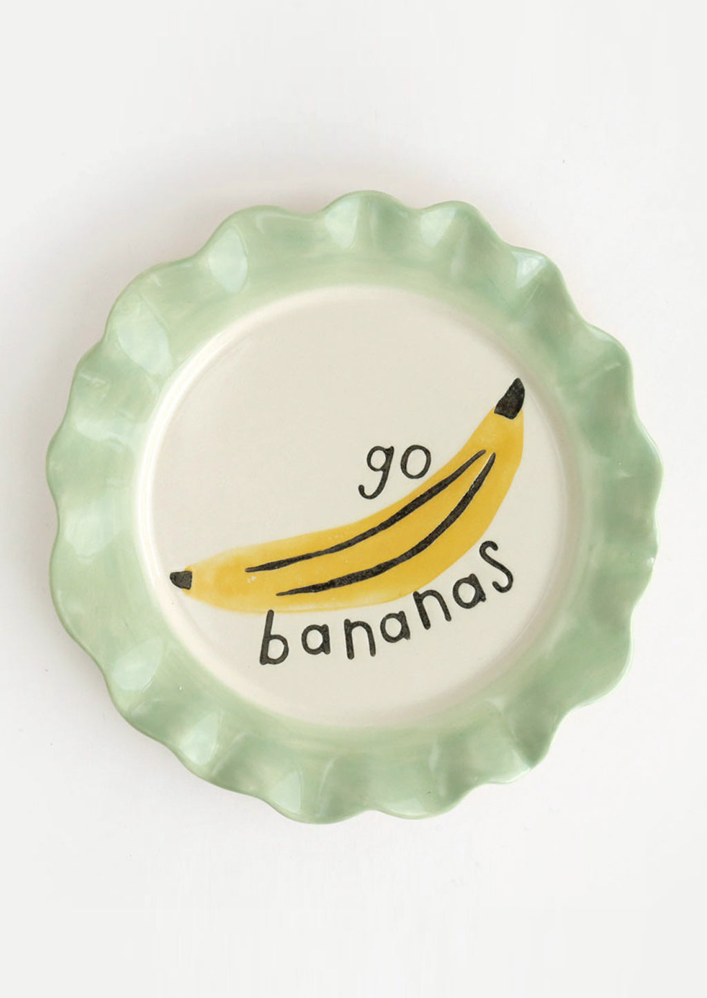 Go Bananas: A printed ceramic plate with mint colored rim and banana graphic, text reads "Go bananas".