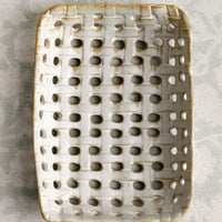 3: A rectangular shaped ceramic tray with open basketweave design.