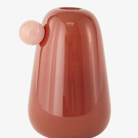 Rosewood: A glass vase in redwood with pink "bauble" knob detailing at top.