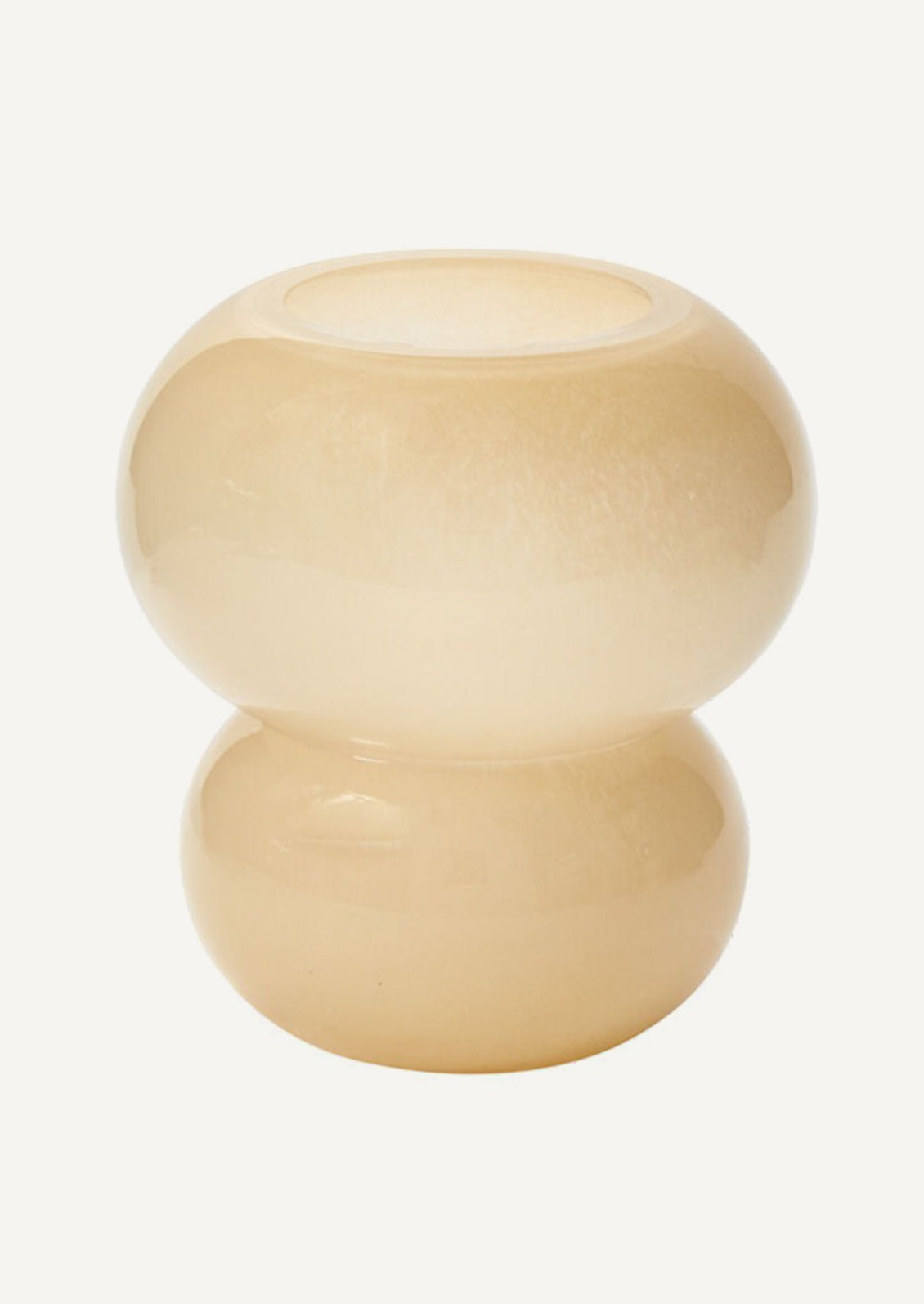 A top-heavy counterbalanced glass vase in round shape and beige hue.