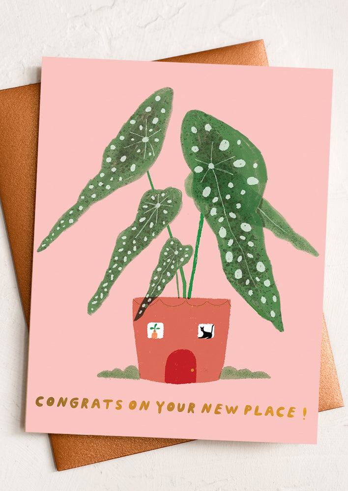 A card with illustration of potted begonia, text reads "Congrats on your new place!".