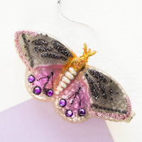 1: A purple and black bejeweled butterfly holiday ornament