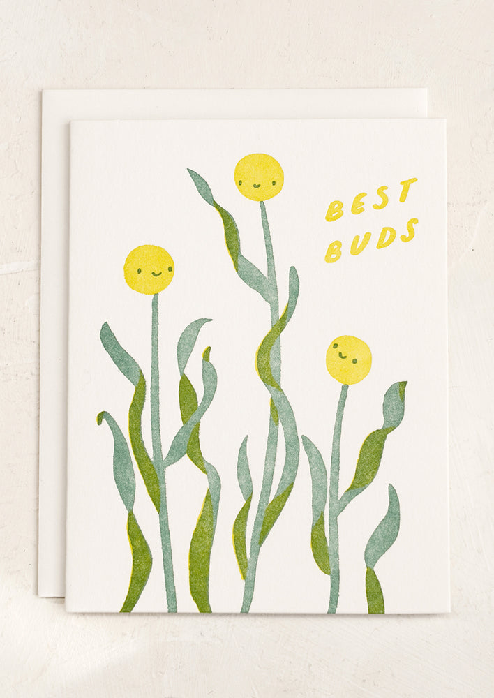 A card with smiley flower print reading "Best buds".