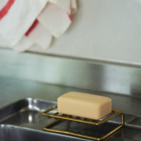 2: A wire brass soap stand.