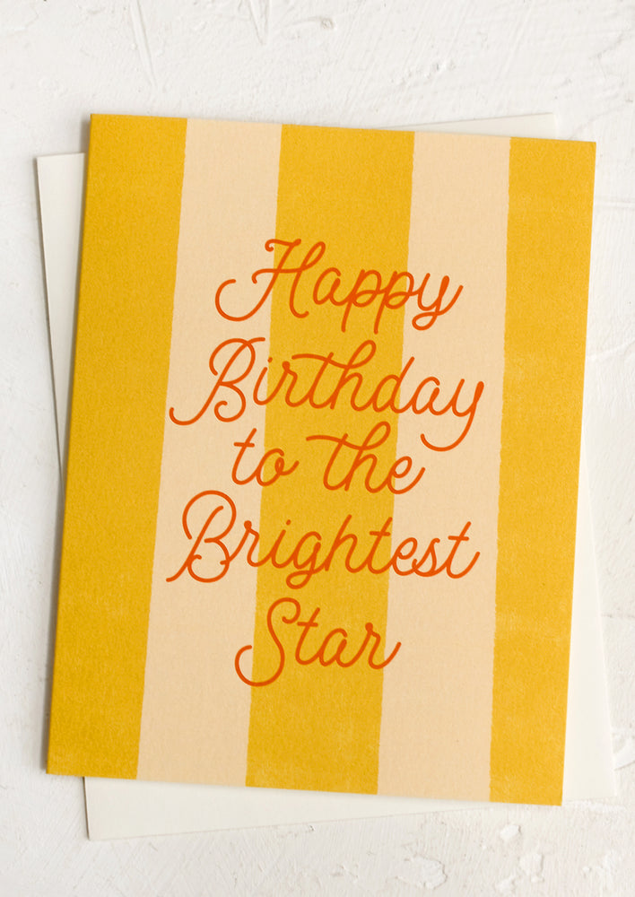 A yellow striped card reading "Happy birthday to the brightest star".
