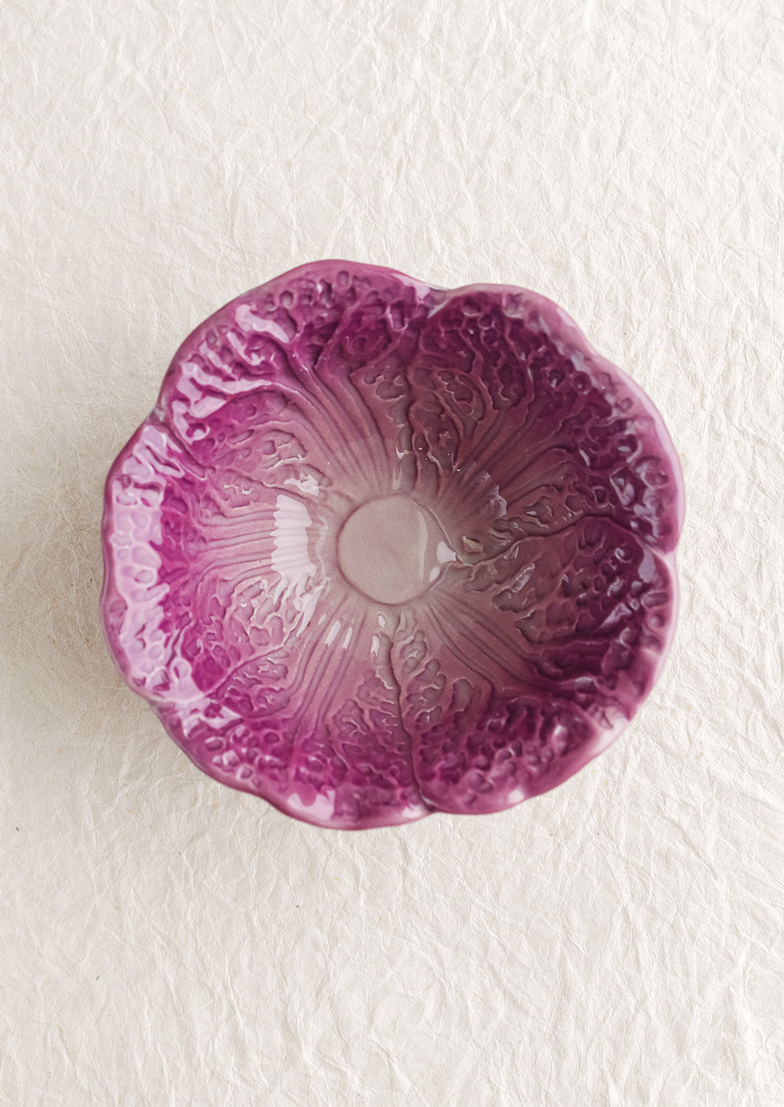 A purple ceramic cabbage bowl.