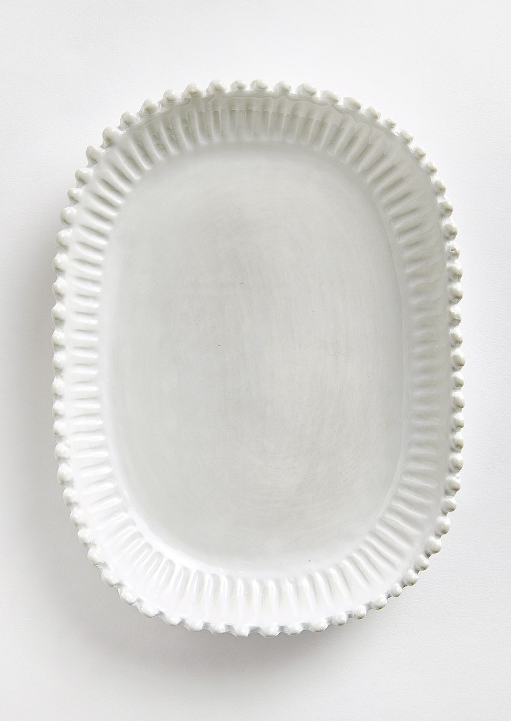 1: A rectangular ceramic platter in white with rounded edges and hobnail pleated border.