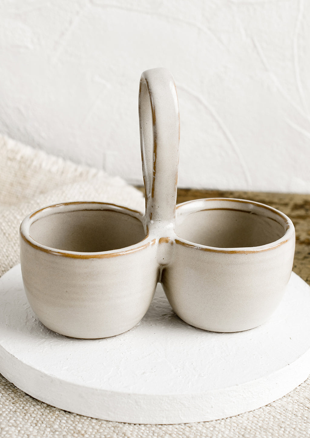 White: A double cellar ceramic vessel in off-white glaze.