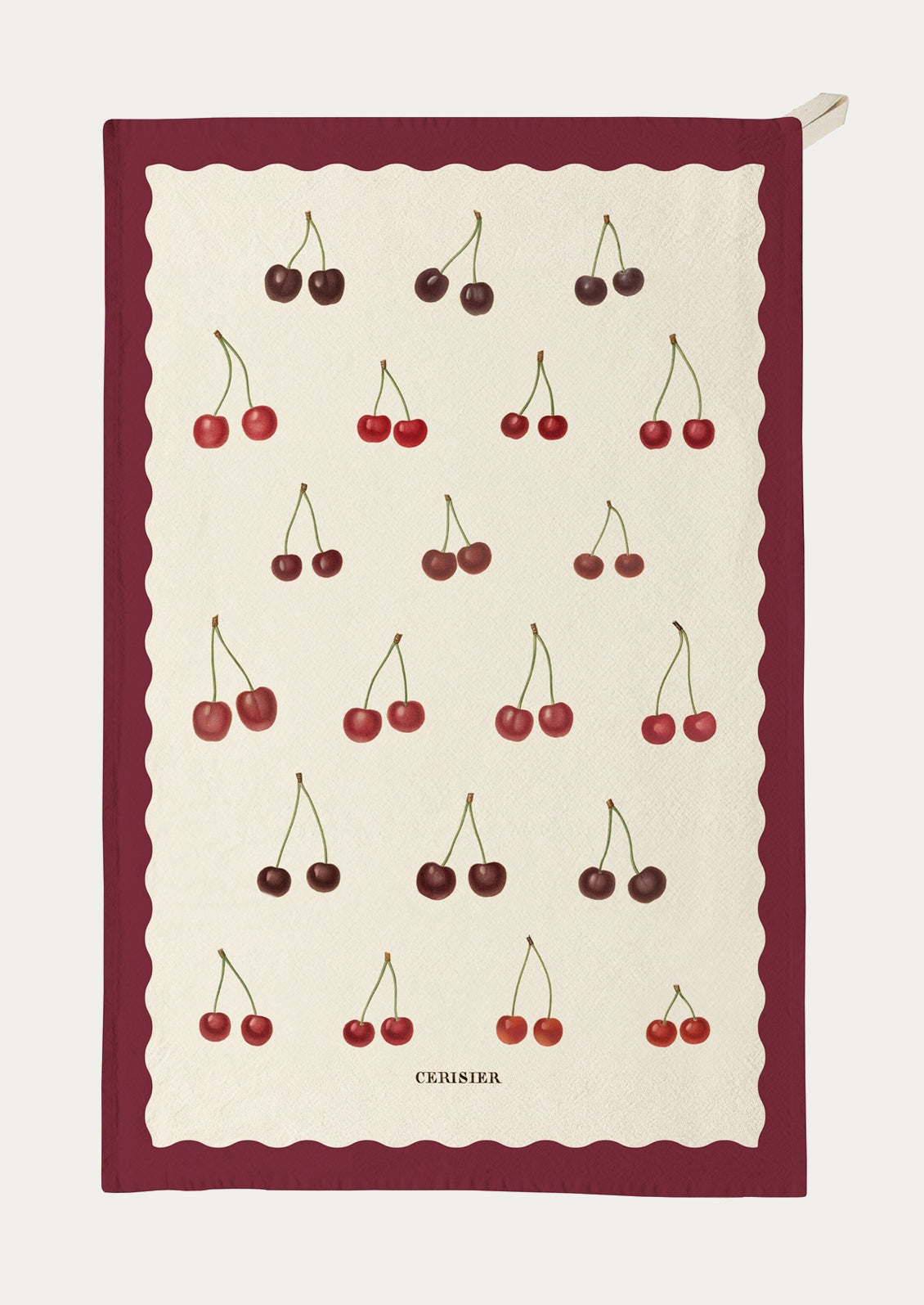 Tea towel with cherry pattern on a white background