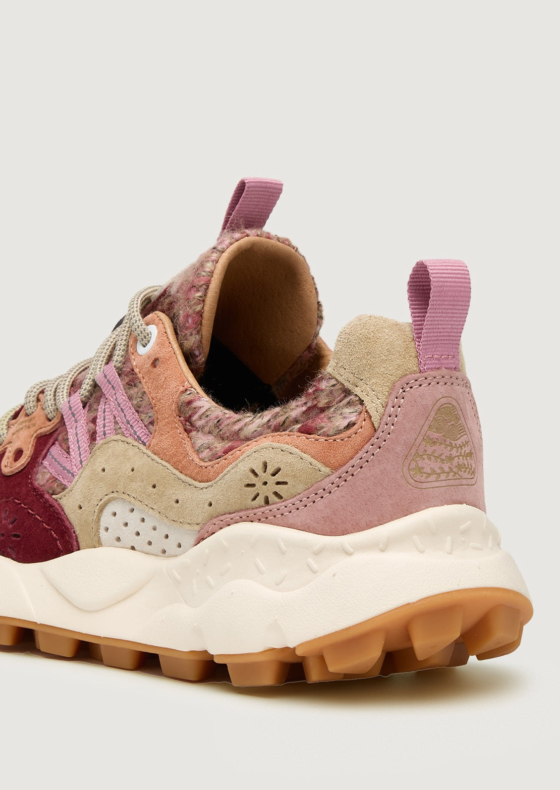 A pair of sporty chunky sneakers in pink wool knit multi.