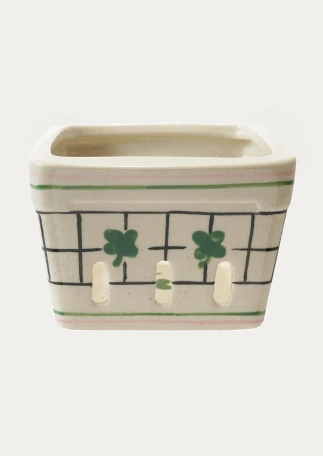 Ceramic berry basket with a clover design.