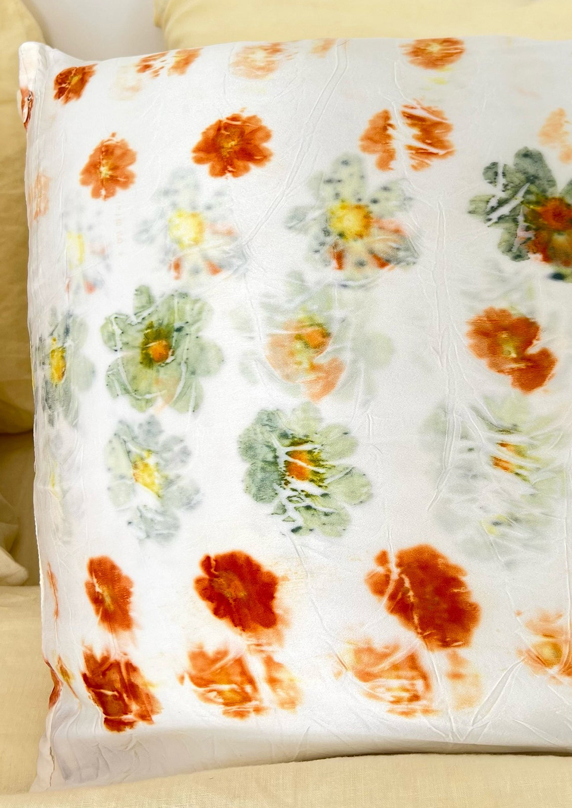 White silk pillowcases dyed in cosmos bundle dye pattern.