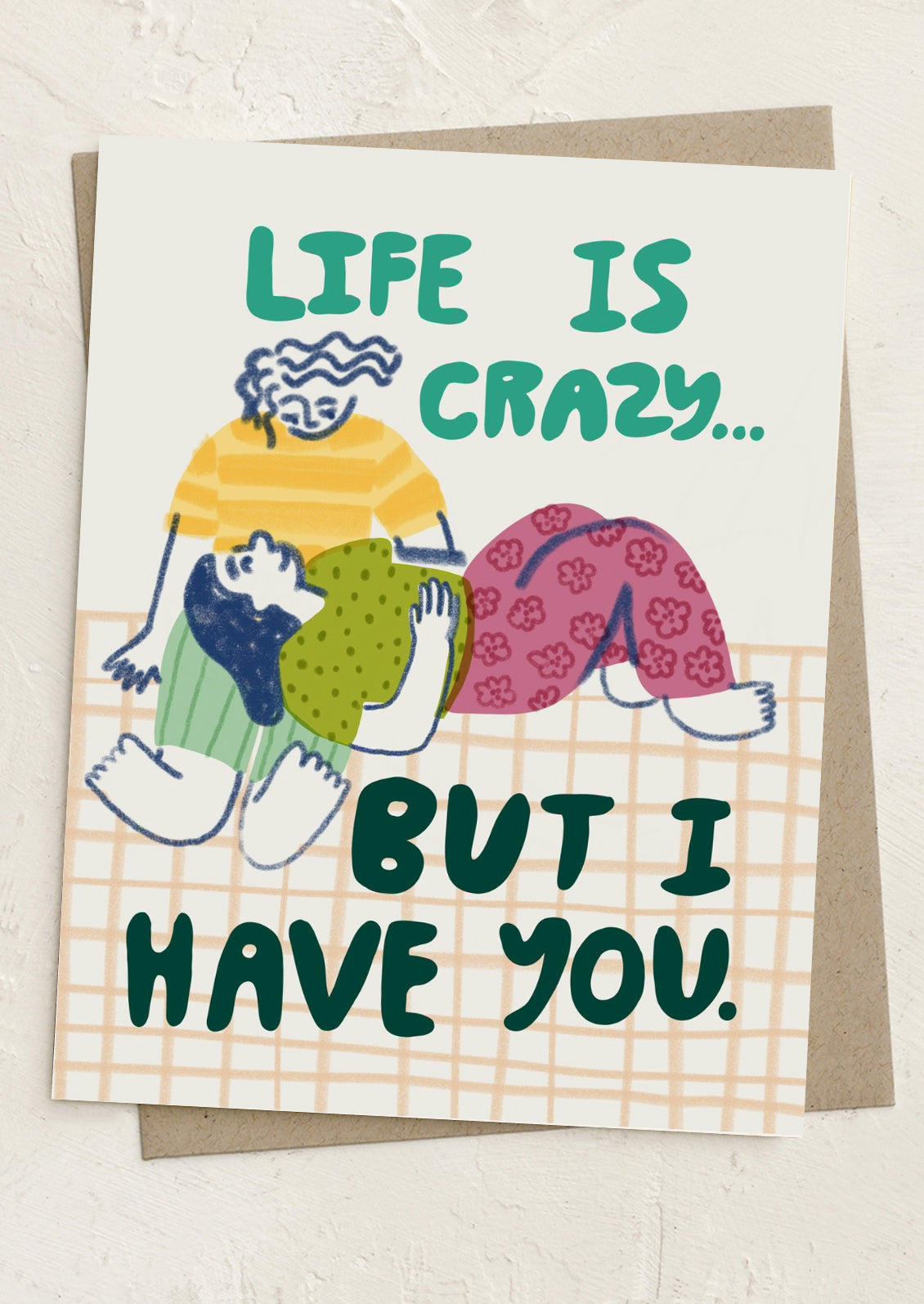 Card with illustration of two people hugging and text 'Life is crazy... but I have you.'