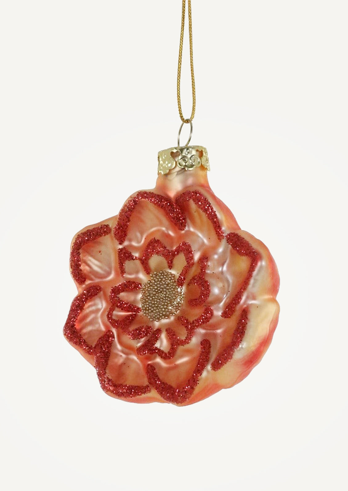A glass ornament of a red-orange flower head.