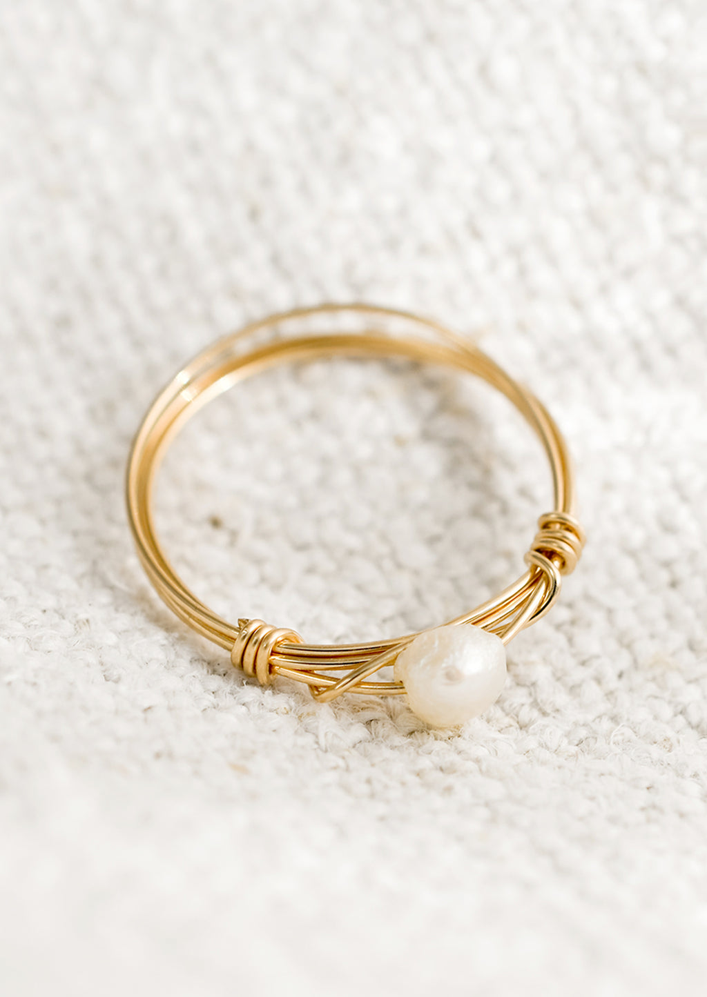 1: A gold wire ring with single pearl bead.
