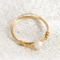1: A gold wire ring with single pearl bead.