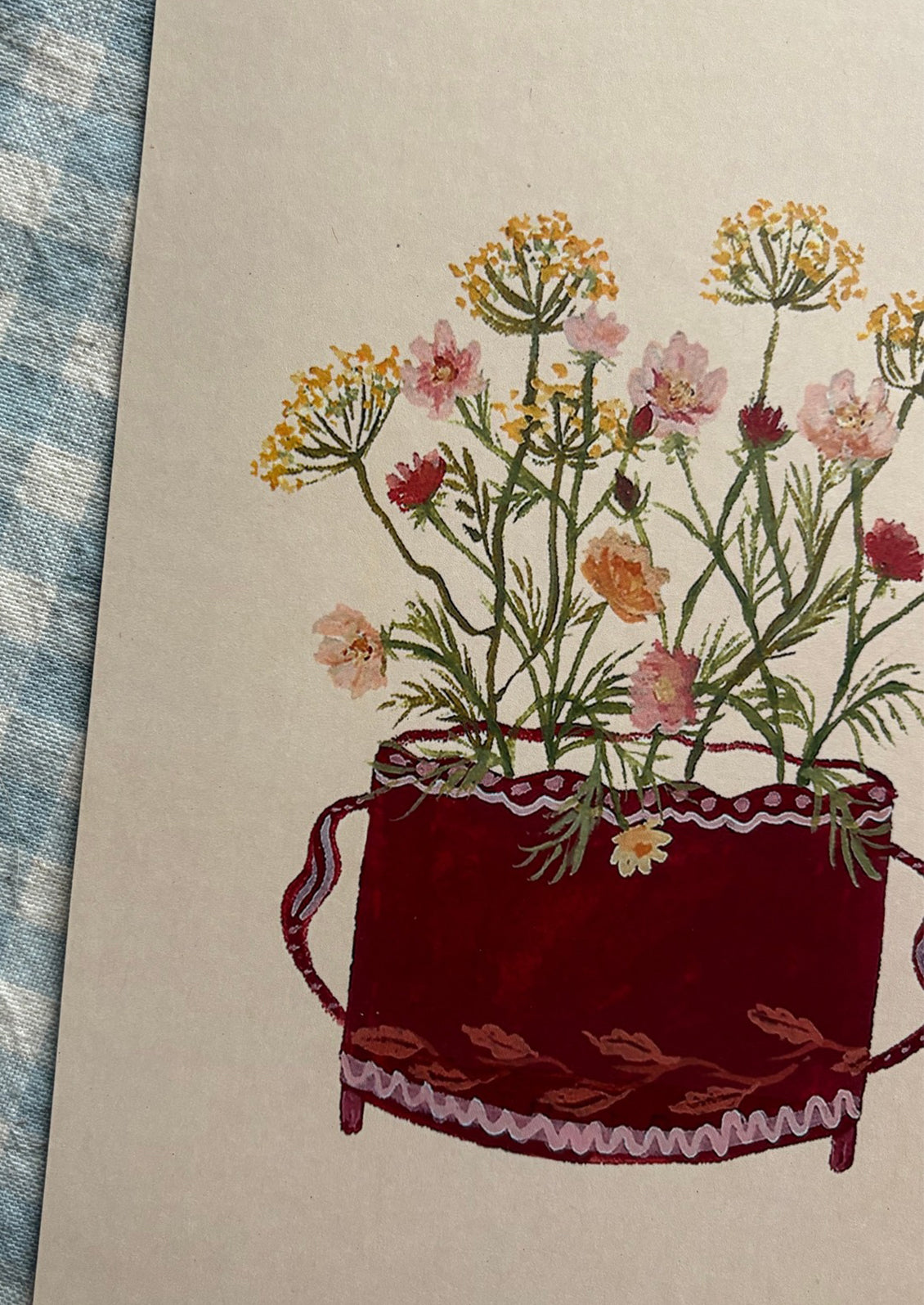 A small illustrated art print of flowers in a dark red pot, on light beige background.