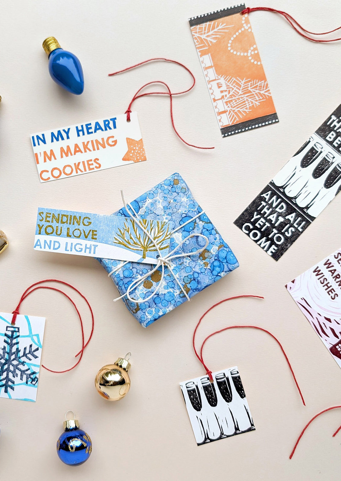 Gift packaging with decorative tags and ribbons on a light background