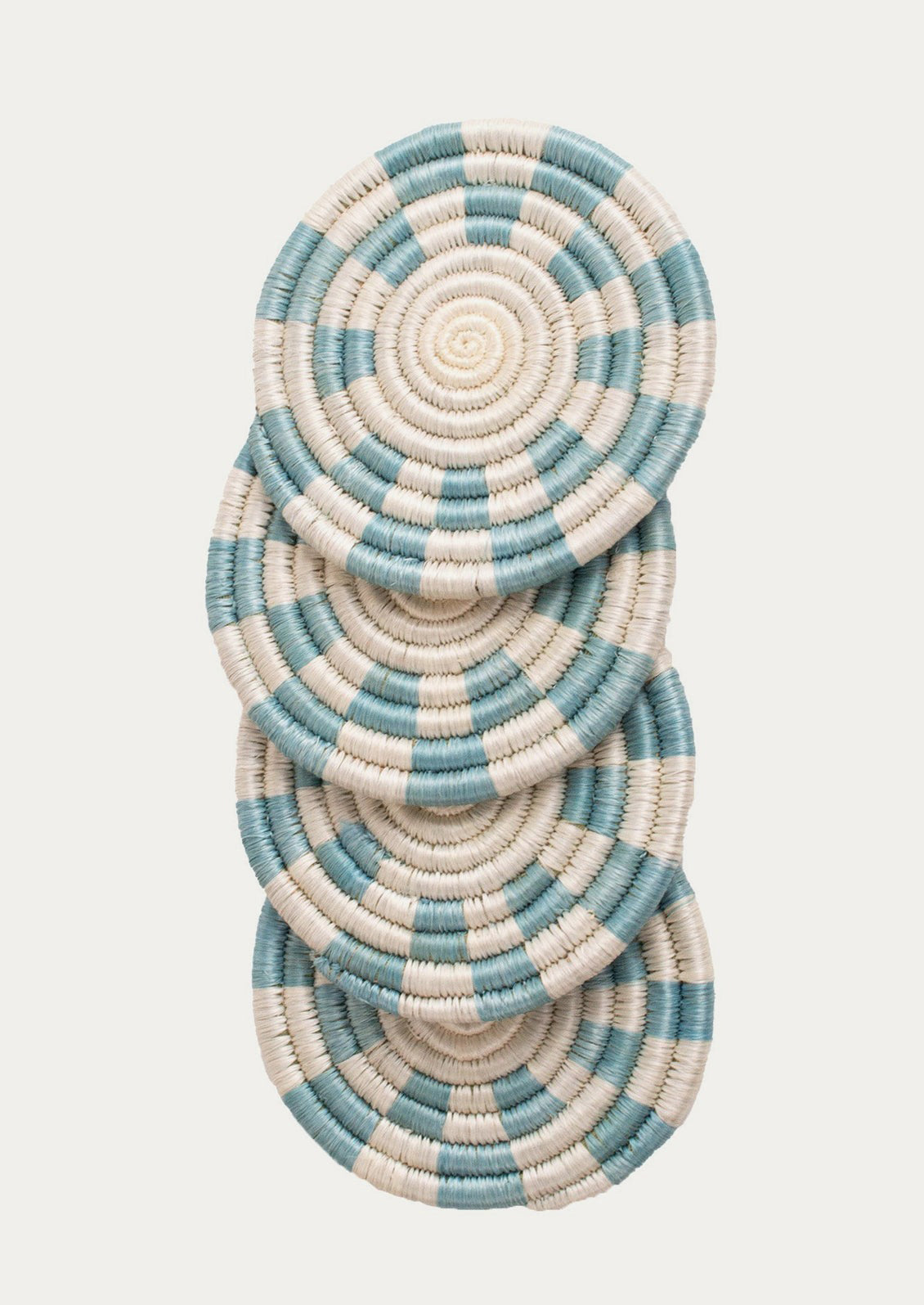 A set of sky blue and white checkered sweetgrass coasters.