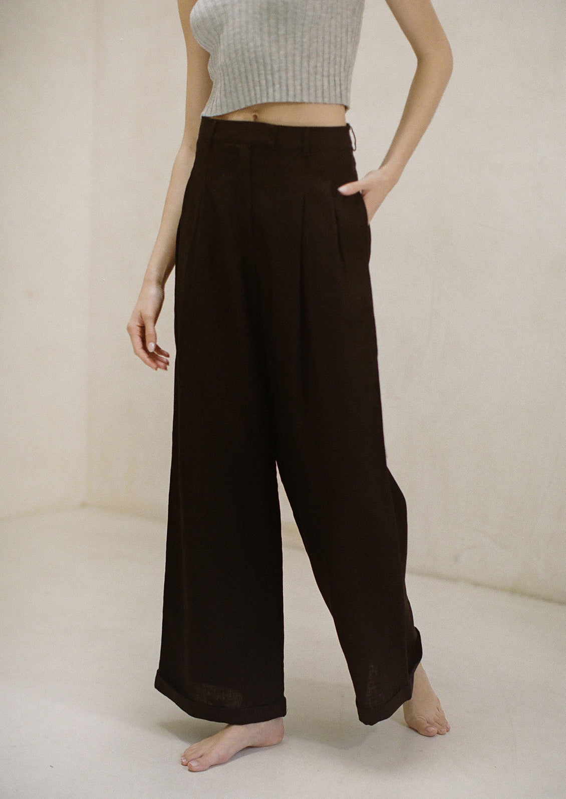 A pair of wide leg black linen pants.
