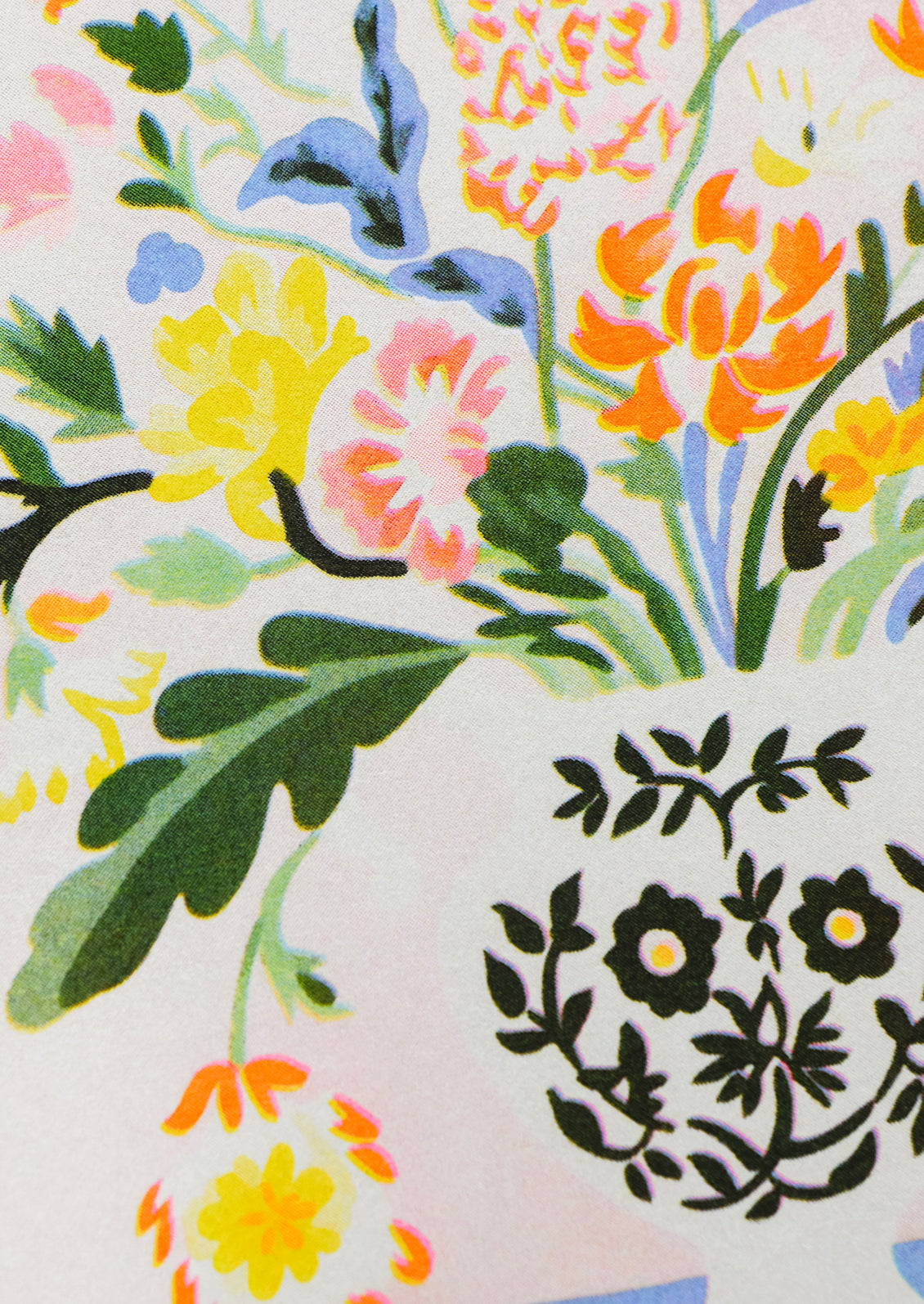 A risograph art print of colorful neon flowers in vase.