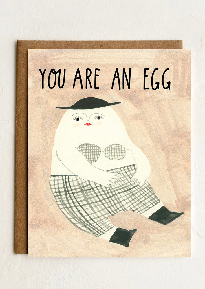 1: A card with whimsical and weird illustration, text reads "You are an egg".