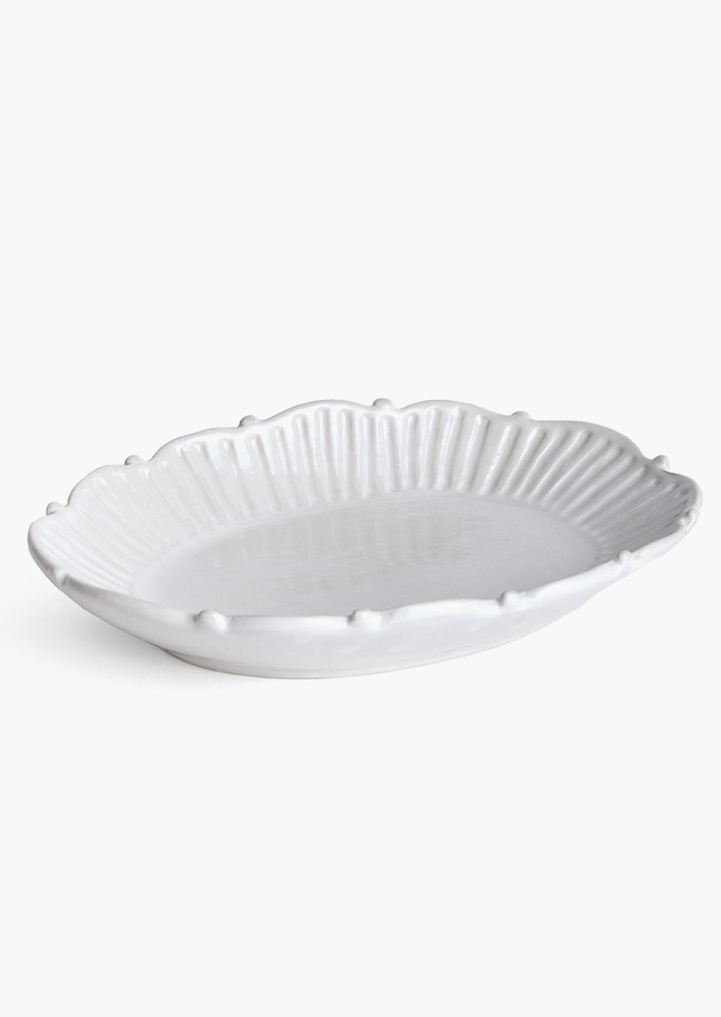 3: An oval shaped tray with ruffled and pleated border with ball detail around edges.