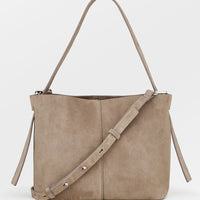Mouse: A suede handbag in mouse grey.