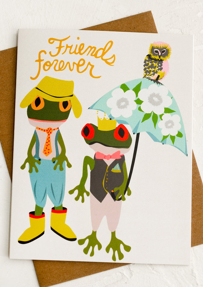 A card with image of two frogs in clothing, text reads "Friends forever".
