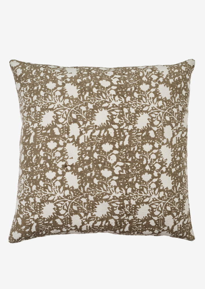 1: A linen pillow in taupe and white abstract floral print.