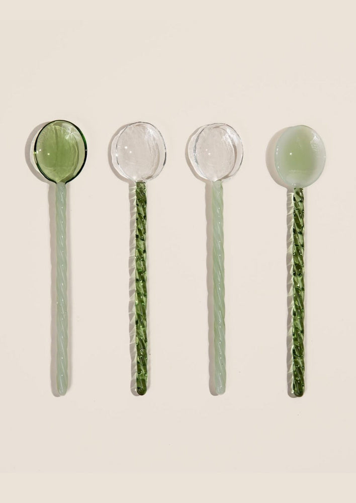 Clear and green glass teaspoons.