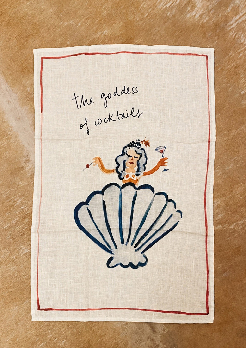 Goddess of Cocktails: A white linen tea towel with Goddess of Cocktail graphic and text.