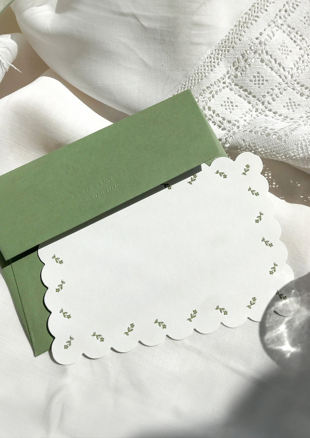 Green Floral: A scalloped white notecard with green floral border and green envelope.