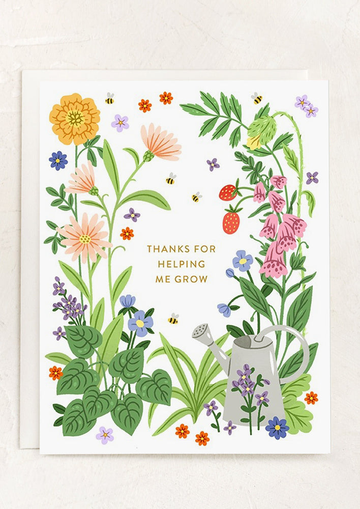 A card with garden imagery reading "Thanks for helping me grow".