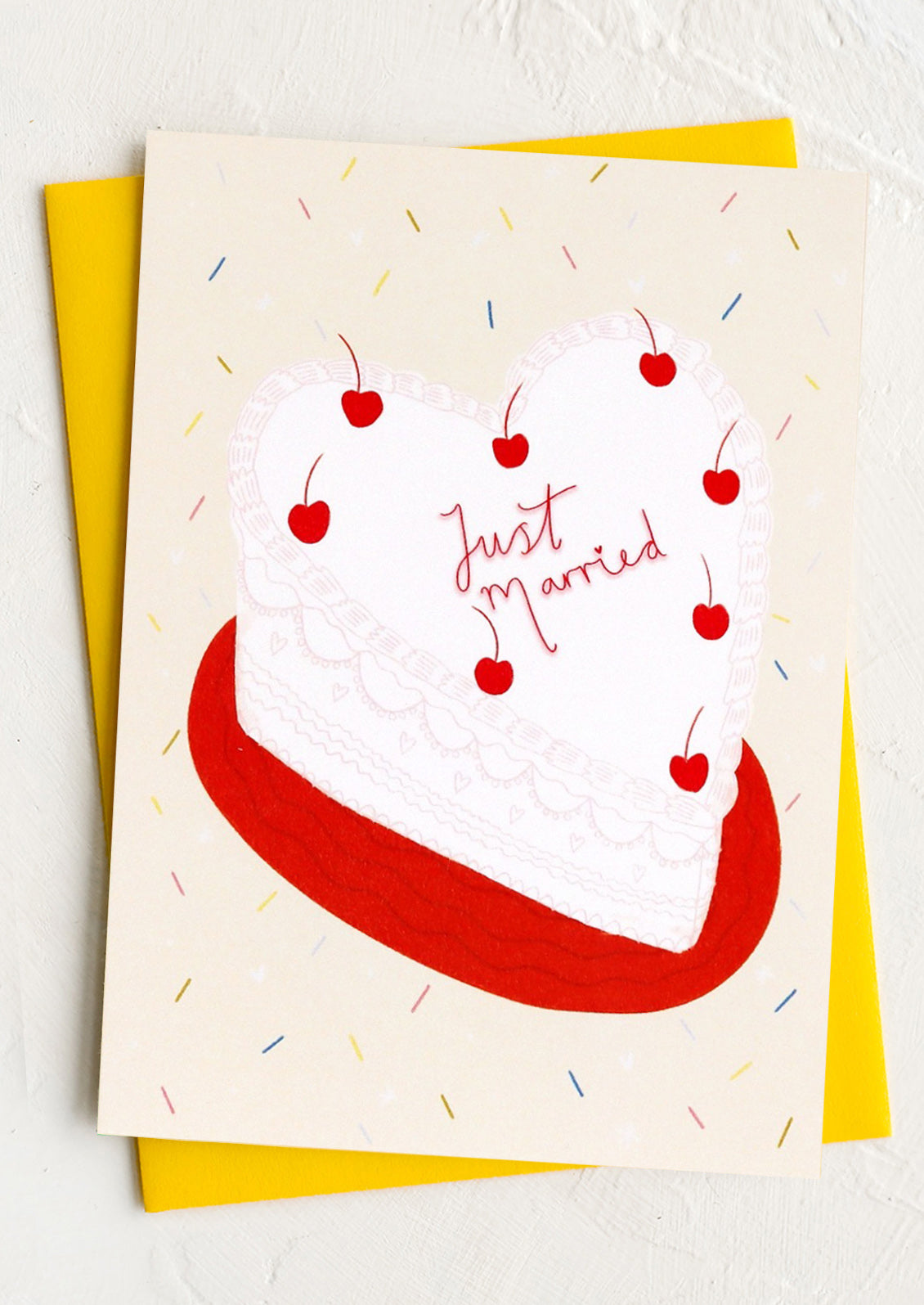 Greeting card with a red heart and 'Just Married' text on a white background