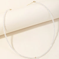 White Multi: A white beaded crystal necklace with quartz stone heart charm.
